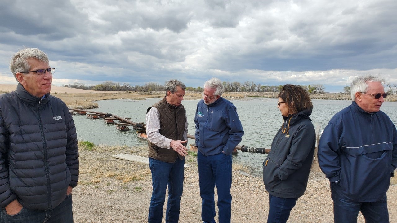Governor Pillen talks with Nebraska Department of Natural Resources Director Tom Riley.