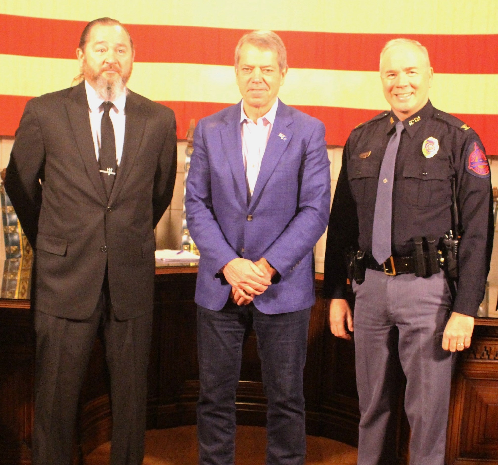 Pictured from left to right: Dan Fiala, President of the State Enforcement Bargaining Council and the State Troopers Association; Governor Jim Pillen; and Colonel John Bolduc, the Superintendent of the Nebraska State Patrol.