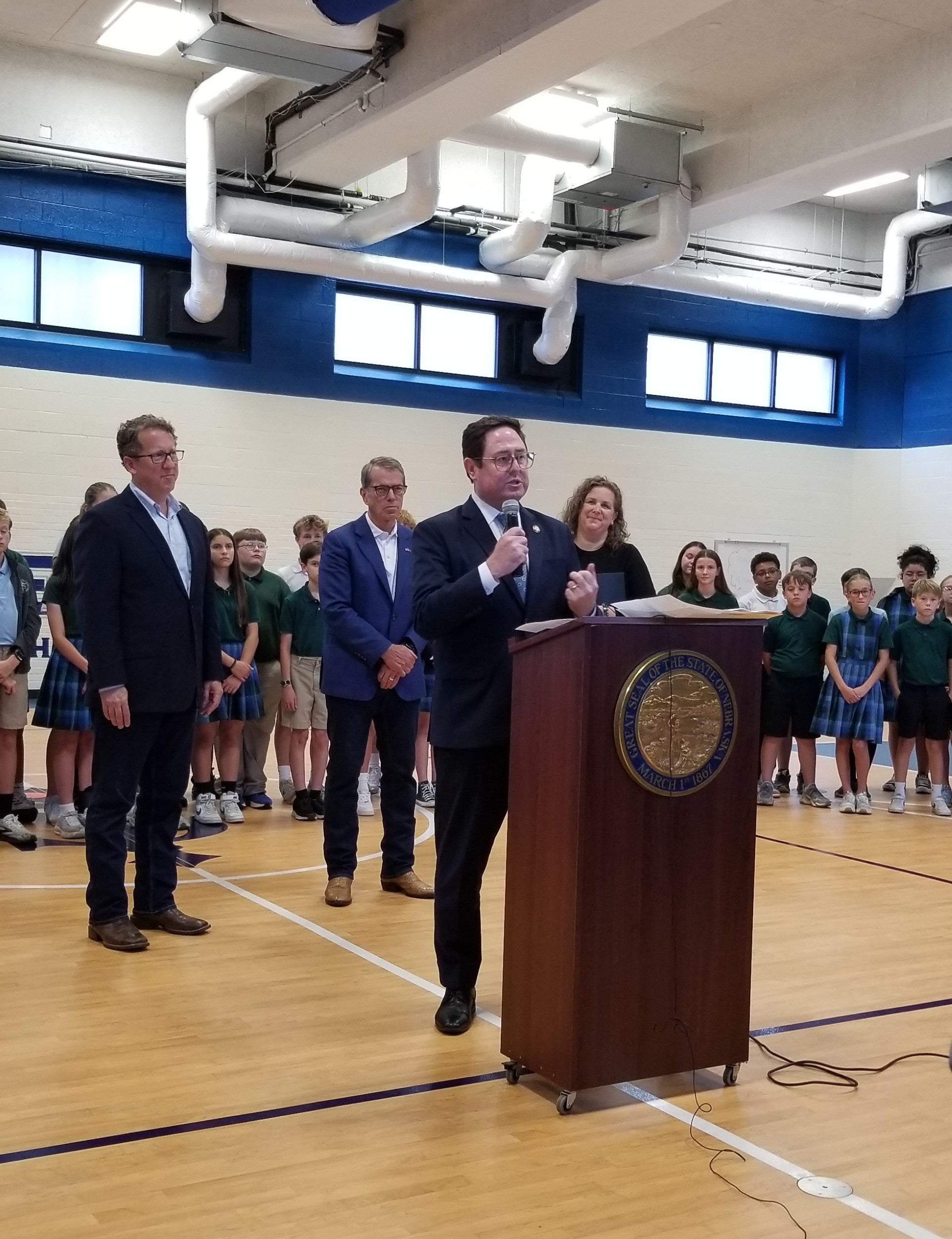 U.S. Rep. Mike Flood speaks to the school audience.
