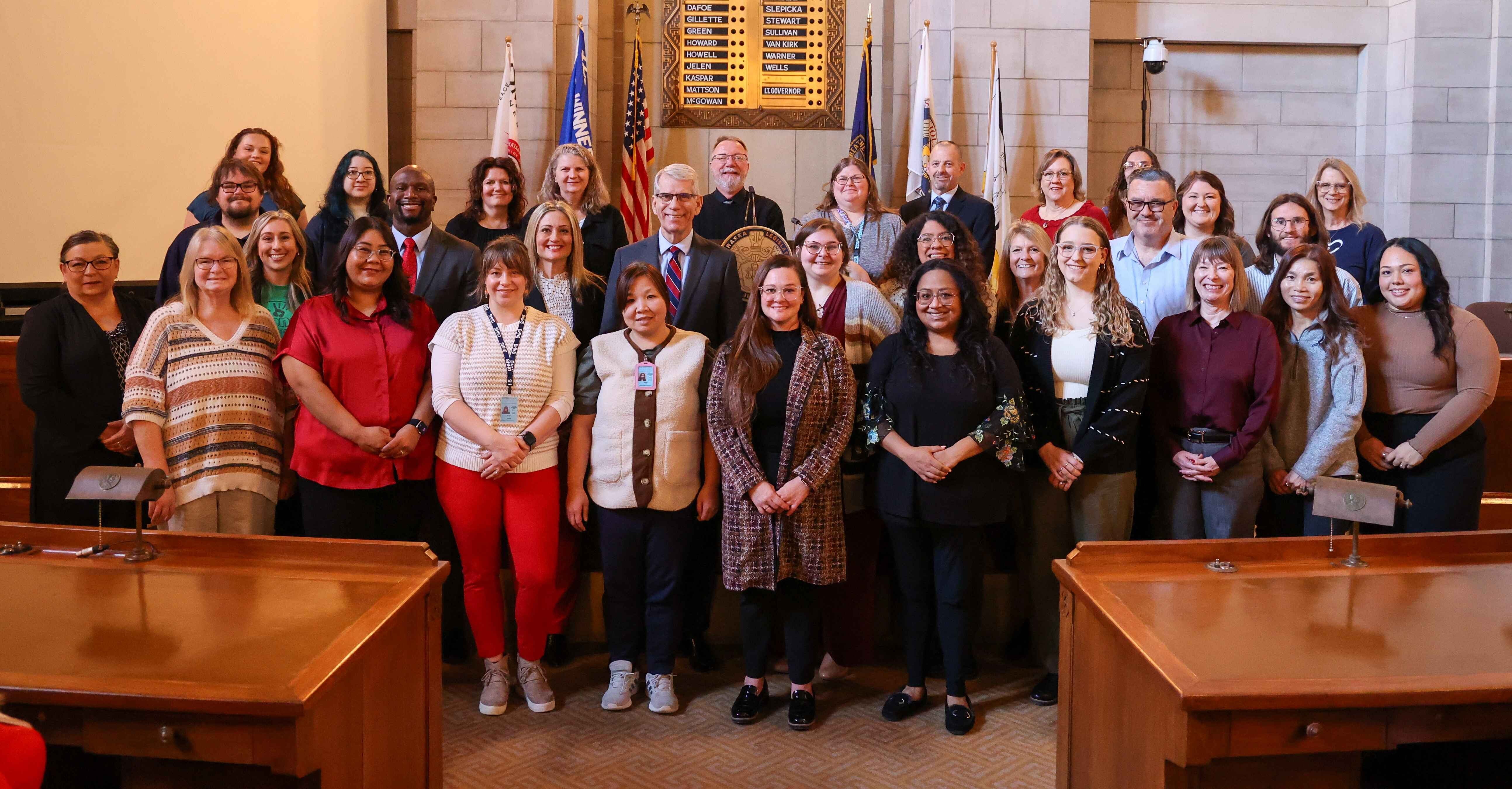 Group photo of, Lt. Governor Joe Kelly, Melissa Mayo, MENTOR Nebraska executive director, DeMoine Adams, CEO TeamMates, Jalin Gerdes, The Friends Program executive director, and the top public servant mentors for 2025