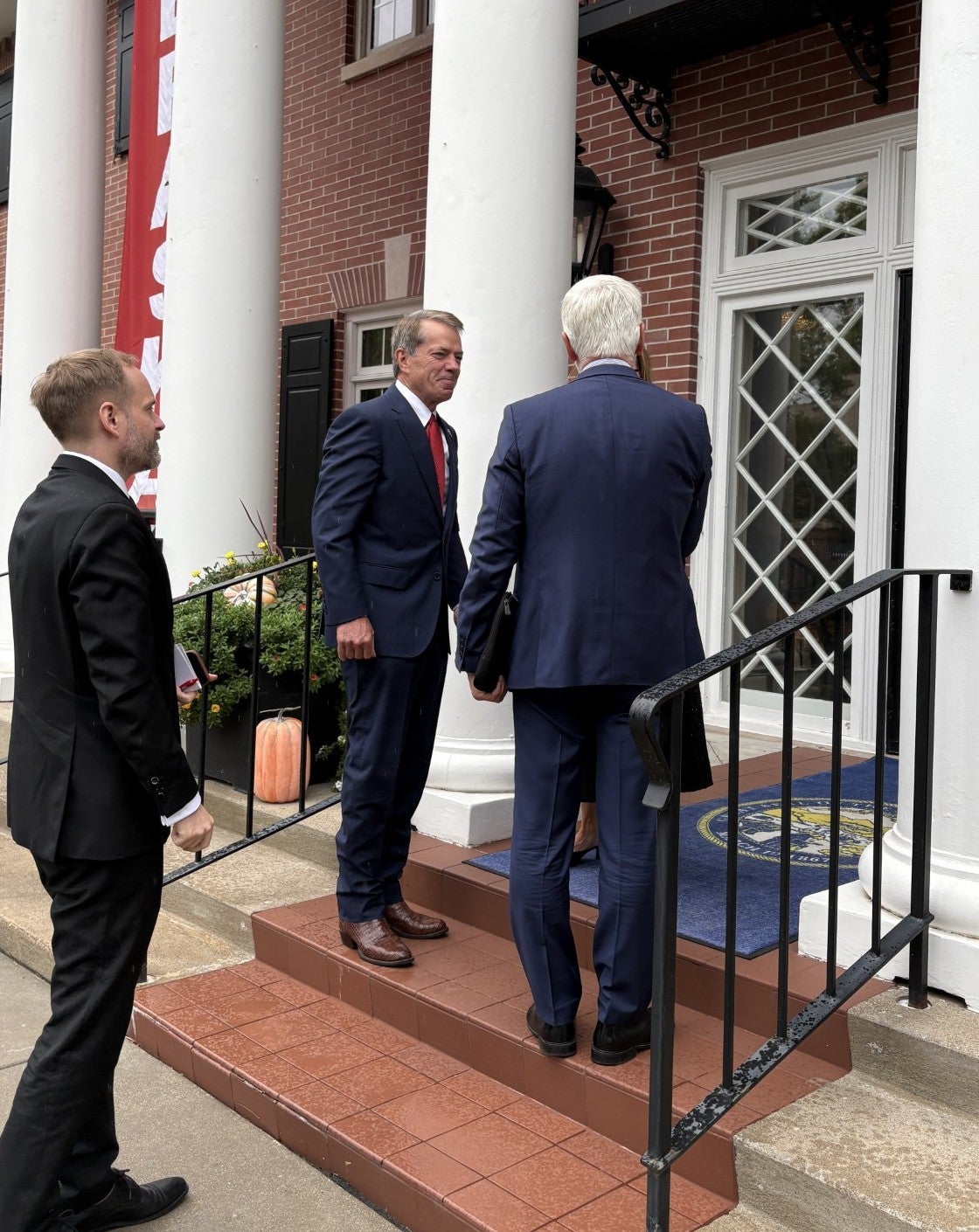 Gov. Jim Pillen welcomes President of the Czech Republic Petr Pavel and Jakub Kulhánek, Ambassador of the Czech Republic to the United States to the steps leading to the Governor's Mansion for a luncheon.