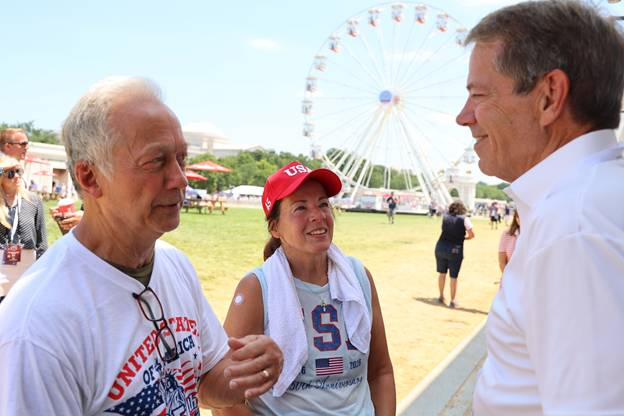 Gov. Pillen greets visitors to Nebraska pavilion