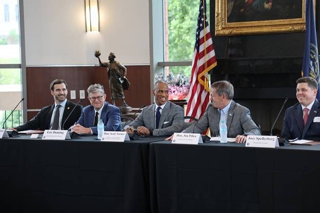 Governor Jim Pillen and United States Housing and Urban Development (HUD) Secretary Scott Turner, surrounded by local business leaders, at the Mortgage Affordability Roundtable at Creighton University