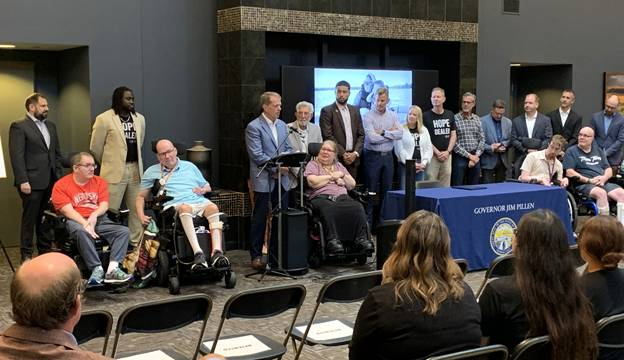 Gov. Pillen addresses attendees at ceremonial signing for LB 1091