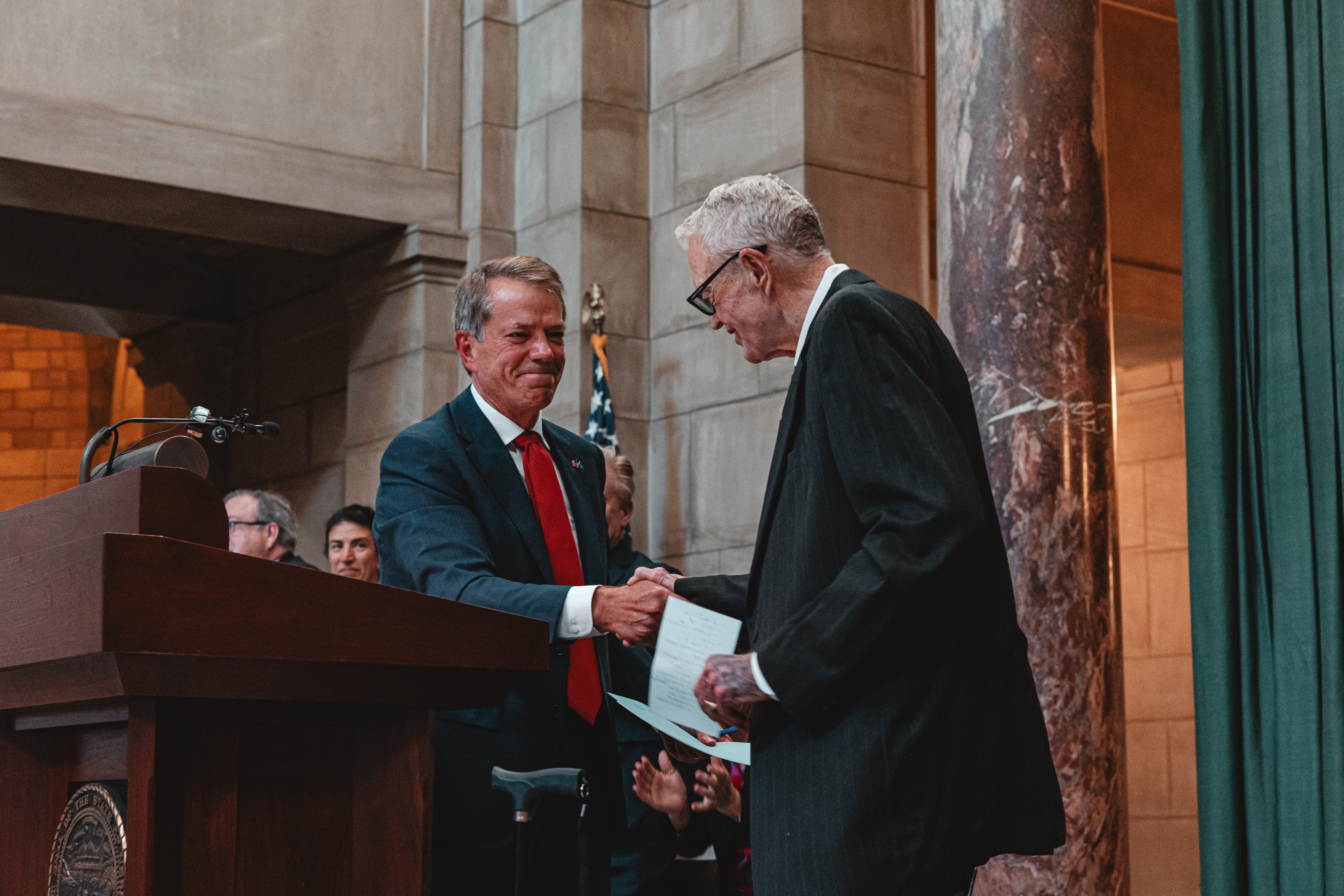 Gov. Pillen welcomes Tom Osborne to podium
