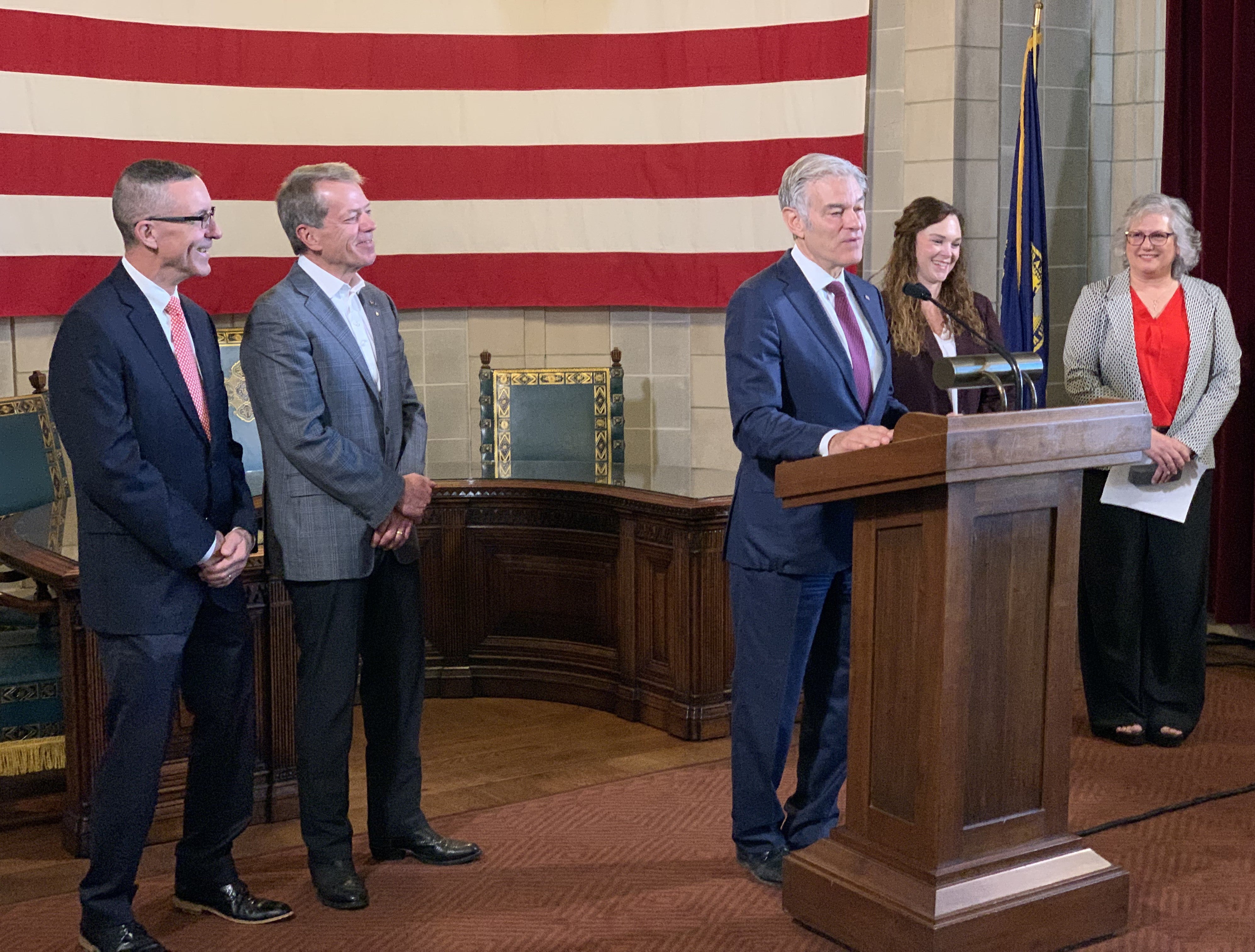 Dr. Mehmet Oz speaks at news conference updating successful award of $177 million in RHTP funding. He is joined by Dave Randolph, Gov. Pillen, Ashley Newmyer, and Laura McDougall.