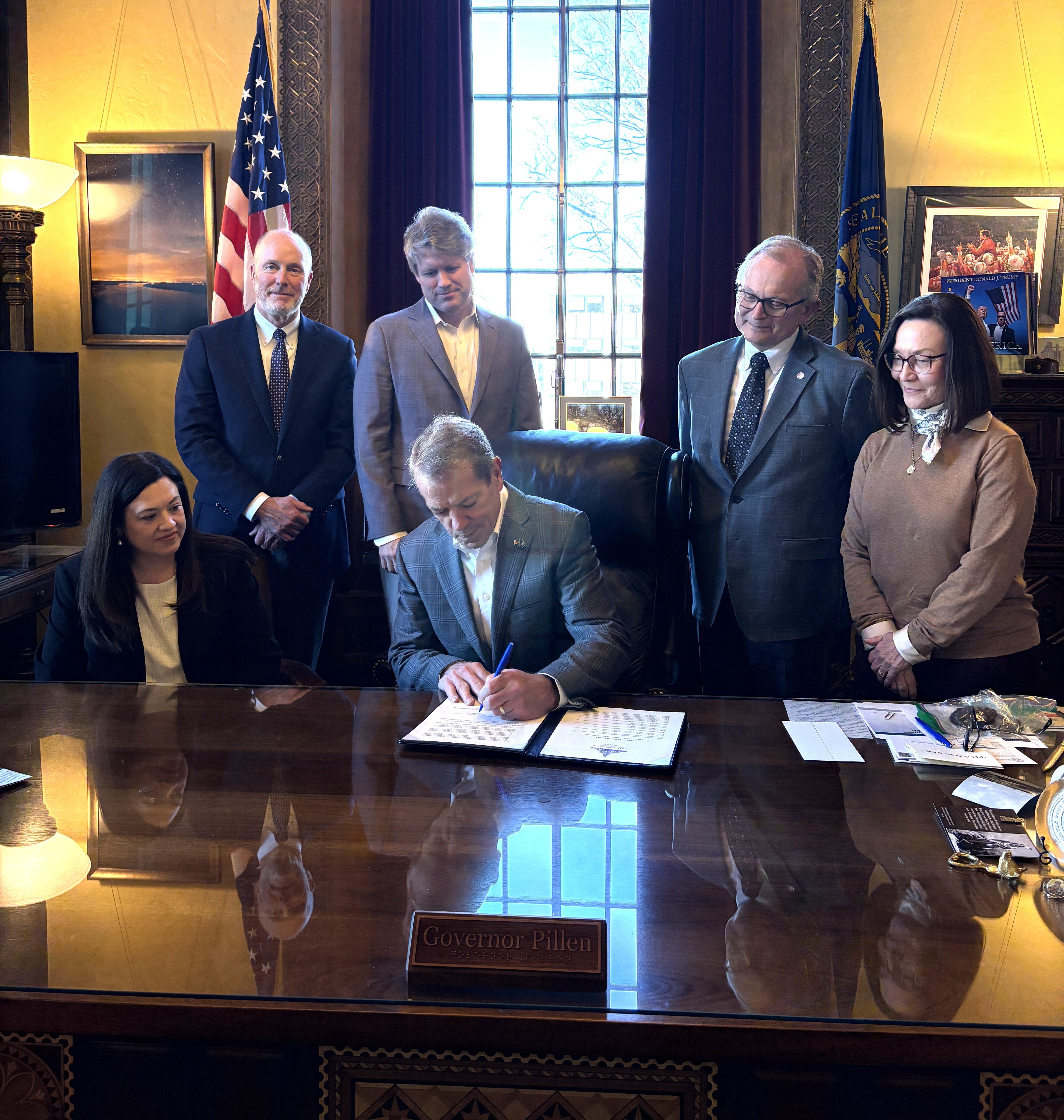 Gov. Jim Pillen and Attorney General Mike Hilgers were joined at the signing by state directors Sherry Vinton, Nebraska Department of Agriculture; Kelly Lammers, Department of Banking & Finance; and Jim Kamm, Department of Revenue.