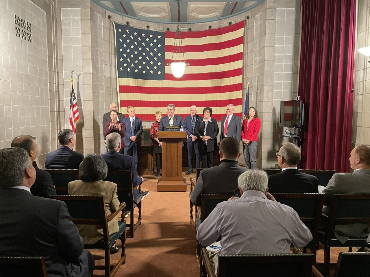 Governor Jim Pillen, accompanied by several state senators including members of the Revenue Committee