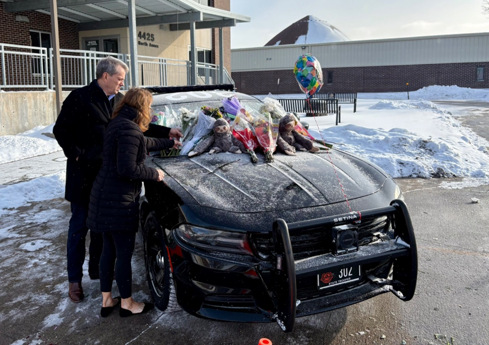 Gov. Pillen and First Lady Suzanne visited the Troop A office in Omaha, leaving flowers on Trooper McAcy’s cruiser.