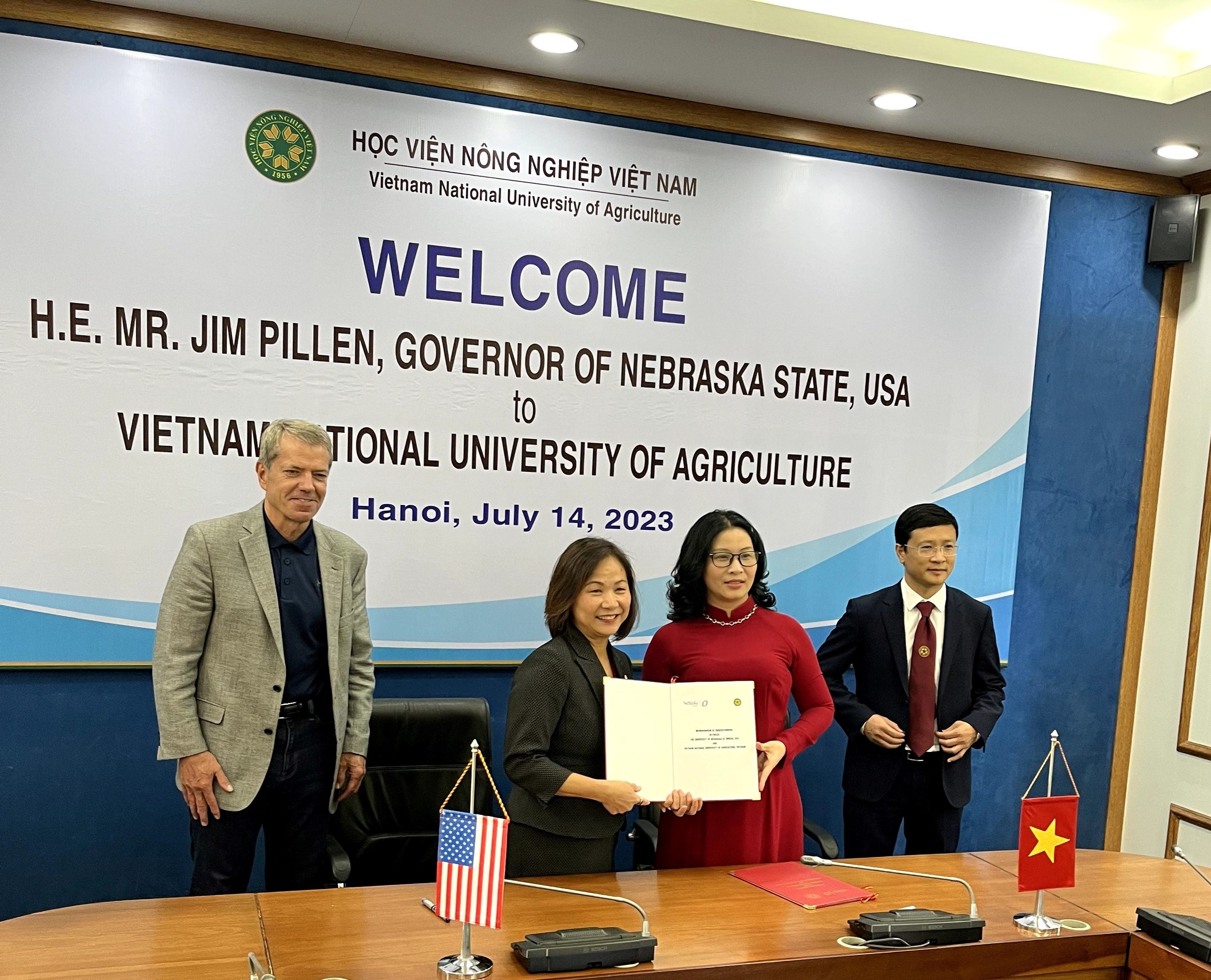Gov. Pillen and Chancellor Li following signing of MOU at the Vietnam University of Agriculture