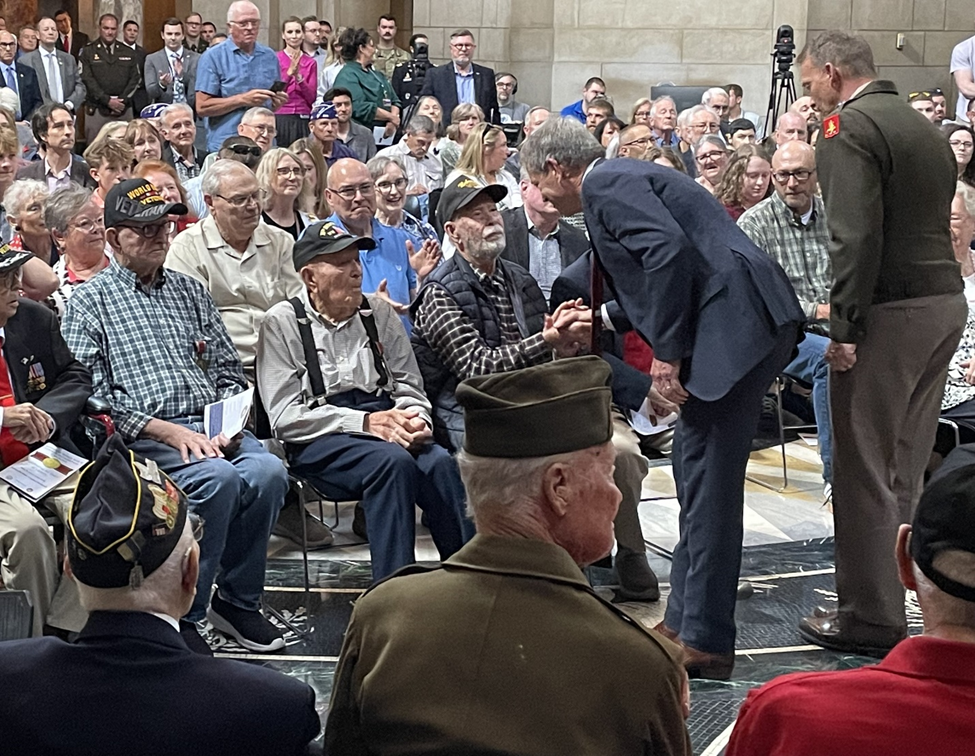 Governor Pillen greets WWII Veterans