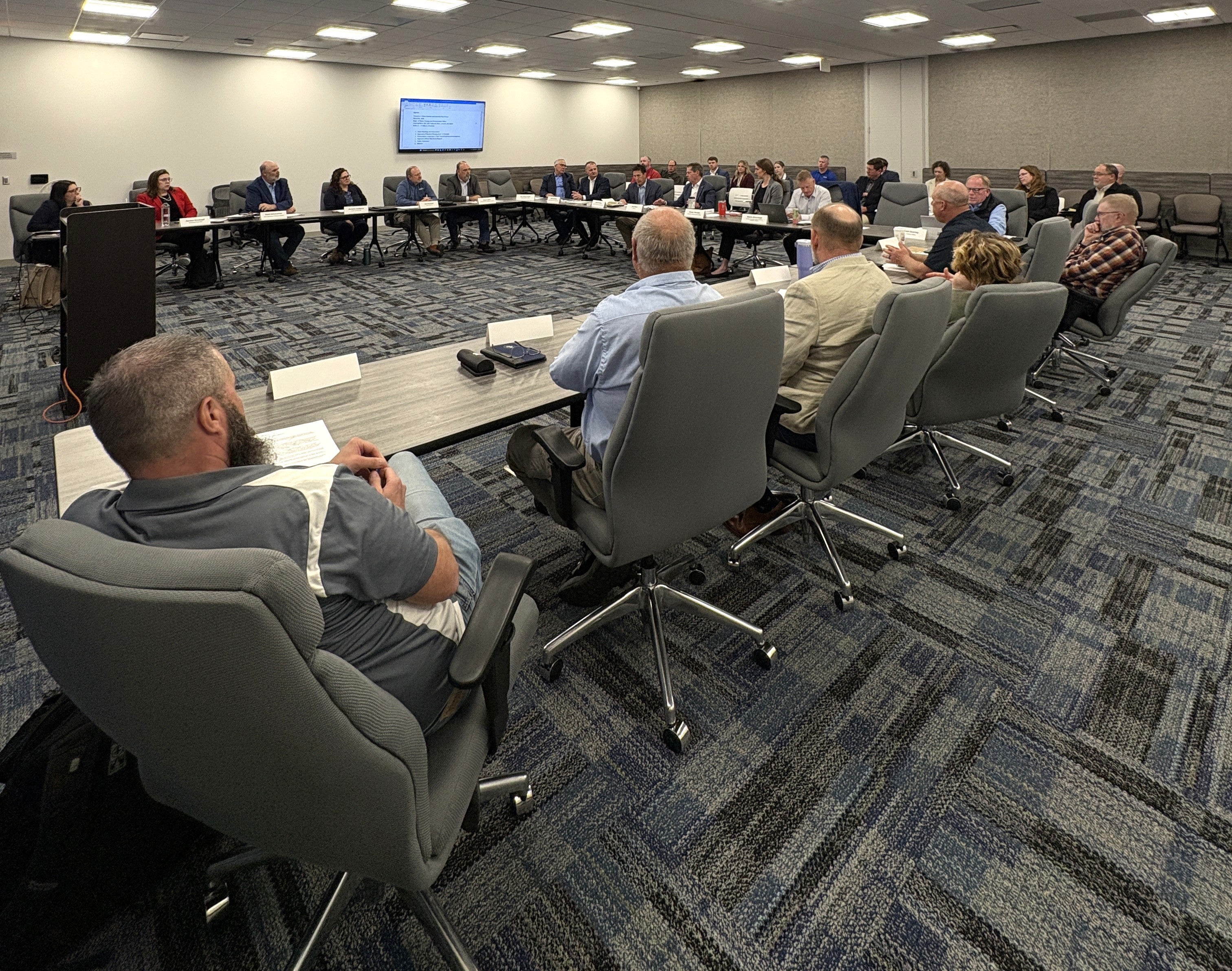 Water Quality and Quantity Task Force members meet around a U-shaped table.