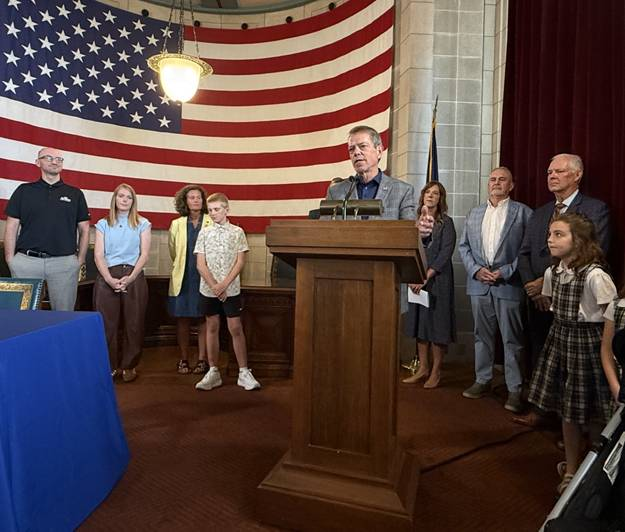 Governor Pillen addresses the audience during the signing of the Back to School Month Proclamation. Senators Dave Murman, Jana Hughes, and and Dan Lonowski, from the Education Committee, attended today’s signing event along with parents and students.